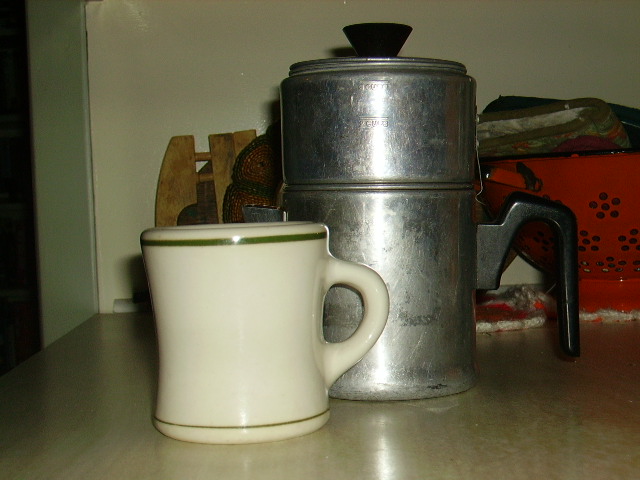 Antique mug from diner; antique drip coffee pot.