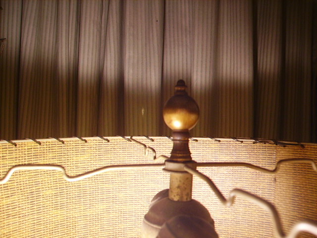 Matching finial on shade.